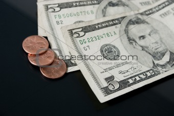 Pennies and Five Dollar Bills