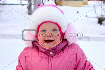 Pretty little girl in winter outerwear.