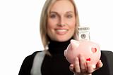 Attractive Business woman holding a piggy bank