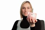 Attractive Business woman holding a piggy bank