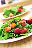Green salad with berries and tomatoes