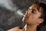 intensively smoking man