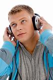 young handsome man enjoying music with headphones