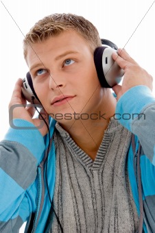 young handsome man enjoying music with headphones