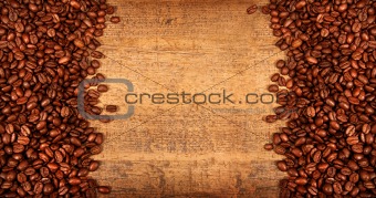 Roasted coffee beans on rustic wood