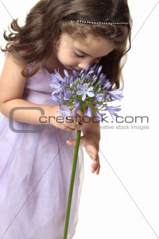 Girl smelling a beutiful flower