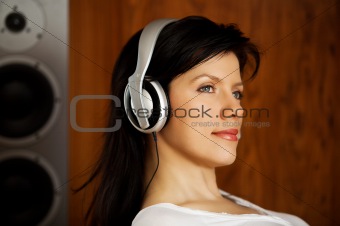 women listening music in headphones