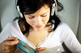 women listening music in headphones