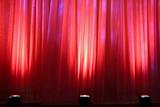 Spot lights on red curtain
