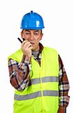 Construction worker talking with a walkie talkie