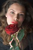 Beautifil lady with red rose. Romantic portrait