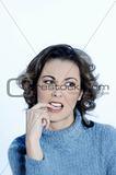 young annoyed woman biting his finger
