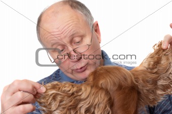 Bald senior man with dog. Emotional portraits series. Isolated on white.