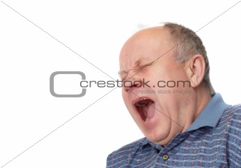 Bald senior man yawns.