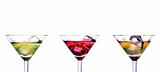 Three martini glasses with multicolor cocktails