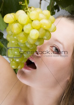 Beautiful Woman portrait with green grape