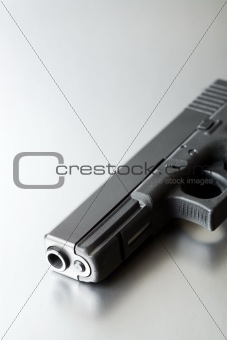 gun on brushed steel