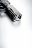 gun on brushed metal background