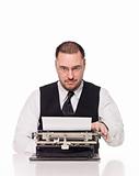Man writing on a vintage typewriter