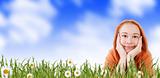 girl relaxing in grass on a meadow