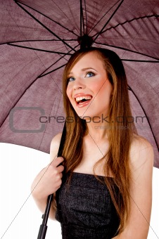 sidepose of smiling woman holding umbrella