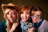 Three Young Girls with Microphone and Tongues Out