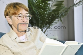 Old woman reading book