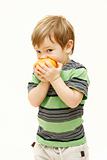 young boy eating orange over white