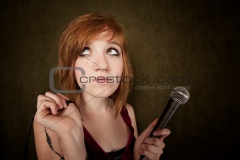 Pretty teenager with microphone