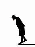 Silhouette of a woman looking down