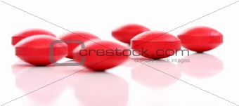 Group of red medicine pills