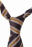 brown necktie with yellow and white pattern
