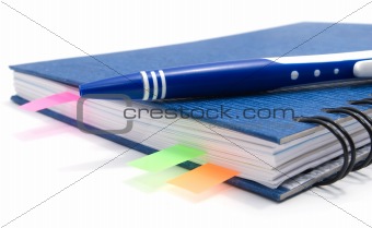 blue notebook with bookmarks