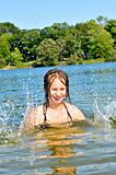 Girl splashing in lake