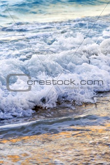Waves breaking on tropical shore