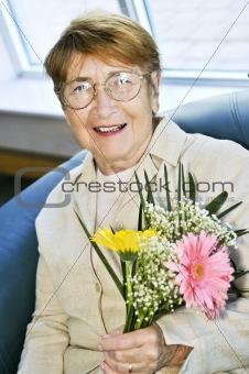 Elderly woman with flowers