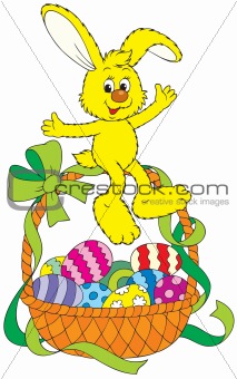 Easter bunny sitting on a basket