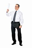 Businessman with rolled paper