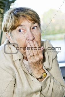 Scared elderly woman