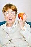 Elderly woman with apple