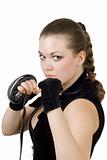 Pretty angry young woman throwing a punch. Isolated