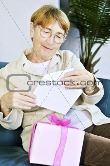 Old woman opening present