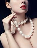young woman with pearls