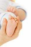 baby's foot in parent's hand