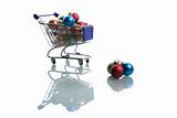 shopping cart full with colorful christmas balls