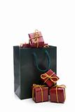green bag with small christmas present box