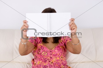 young woman reading white book