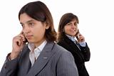 two businesswoman holding mobile phones