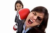 Two businesswoman with boxing gloves fighting