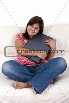 beautiful teenager holding laptop computer